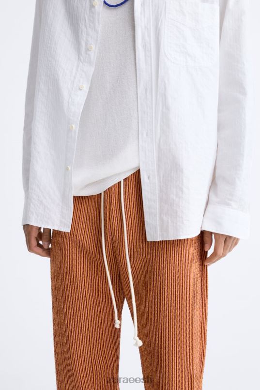 Zara geomeetrilised žakaarpüksid mehed ekru/kollane Riietus 42F0H961